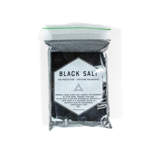 Small plastic baggie filled with black salt. Label is black and white with uses- for protection and creating boundaries. 