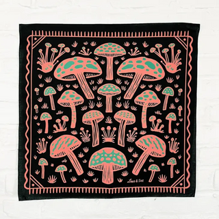 Square bandana on black cloth with pink mushrooms with green highlighting on each mushroom, and a pink squiggly border.