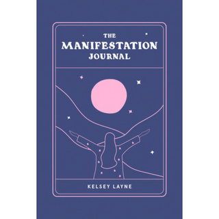 Cover of The Manifestation Journal by Kelsey Layne is blue with a simple pink line drawing of a woman holding her hands out toward a full moon.