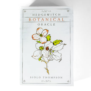 Box of the Hedgewitch Botanical Oracle is white with a simple drawing of flowers on the front. 