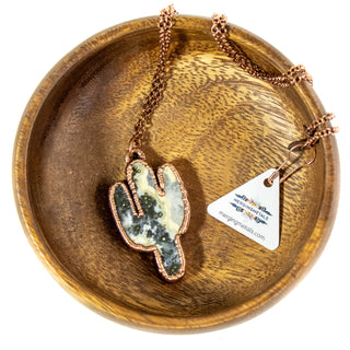 Ocean Jasper saguaro cactus necklace on brass chain shown in wooden bowl with tag