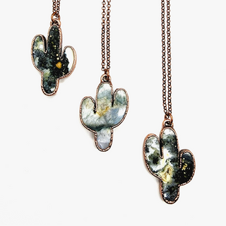 Three ocean jasper saguaro cactus necklaces showing natural variations of the stone- hues of greens and white.
