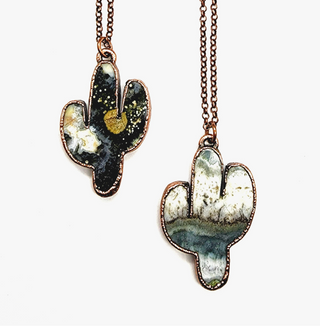 Two ocean jasper saguaro cactus necklace showing the variation in natural colors of the stone. Deep greens, blues, whites and grey