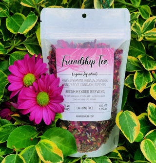 Package of Friendship Tea with label with a foliage and flower background.