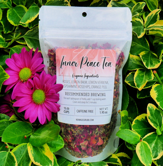 Package of Inner Peace loose herbal tea against a foliage and flower background.