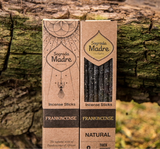 Two boxes of Sagrada Madre Frankincense incense sticks- one shows the front of the box with a clear window to see the resin incense sticks inside, the other shows the back of the box.