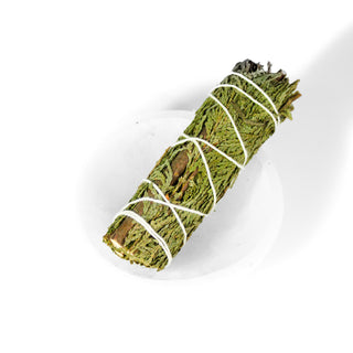 Cleansing cedar bundle, approximately four inches, tied with white string. Shown on a white background. 