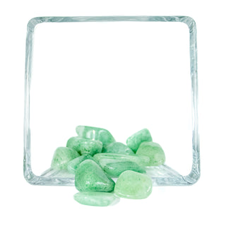 Mint colored green aventurine tumbled pocket stones in a glass bowl 