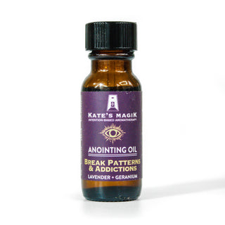 Break Patterns and Addictions anointing oil in a small amber bottle with purple label. 