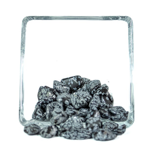 Several black snowflake obsidian tumbled pocket stones with white, light grey spotting. 
