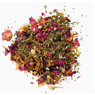 Dried green herbs with pink and orange dried flowers. Loose leaf tea.