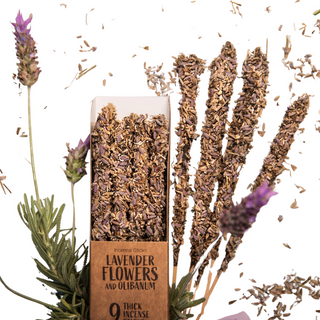 Extra thick resin incense covered in loose lavender flowers- shown in the box and outside of it. Live lavender flowers on the stem are next to it