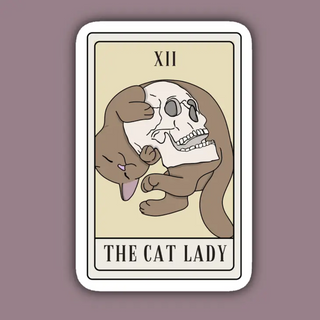 Sticker is in the rectangular shape of a tarot card, with a cat cuddling a skull. The roman numerals XII are at the top and the text The Cat Lady is at the bottom in the format of a tarot card.