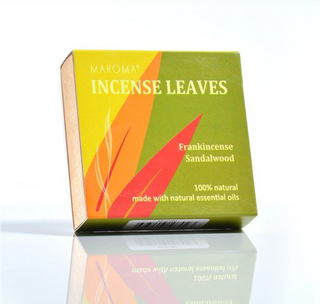 Box of Maroma Incense Leaves, Frankincense and Sandalwood variety. Box is yellow and grene with orange and red leaf drawings.