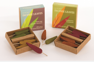 Boxes of Maroma Incense Leaves showing the inside of the boxes containing different colored leaf shaped incense sticks.