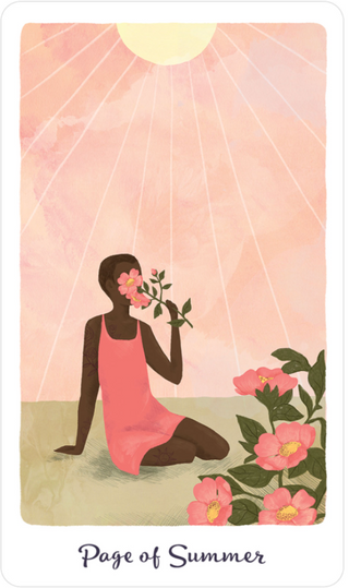 The Page of Summers card from the Harmony Tarot deck shows a person sitting on the ground next to pink flowers with flowers in front of her face