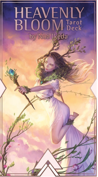 Box of the Heavenly Bloom Tarot Deck. Cover shows a woman flying holding a wand with a blue crystal. She is wearing a white dress and has horns with leaves. The background is dusk.