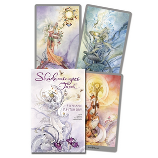 Shadowscapes tarot deck box is white and lavender with an etheral image of a woman and swans with purple flowers. Three other cards from the deck surround the box.