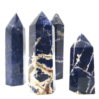 Four sodalite generators showing natural variation in size, shape and color.